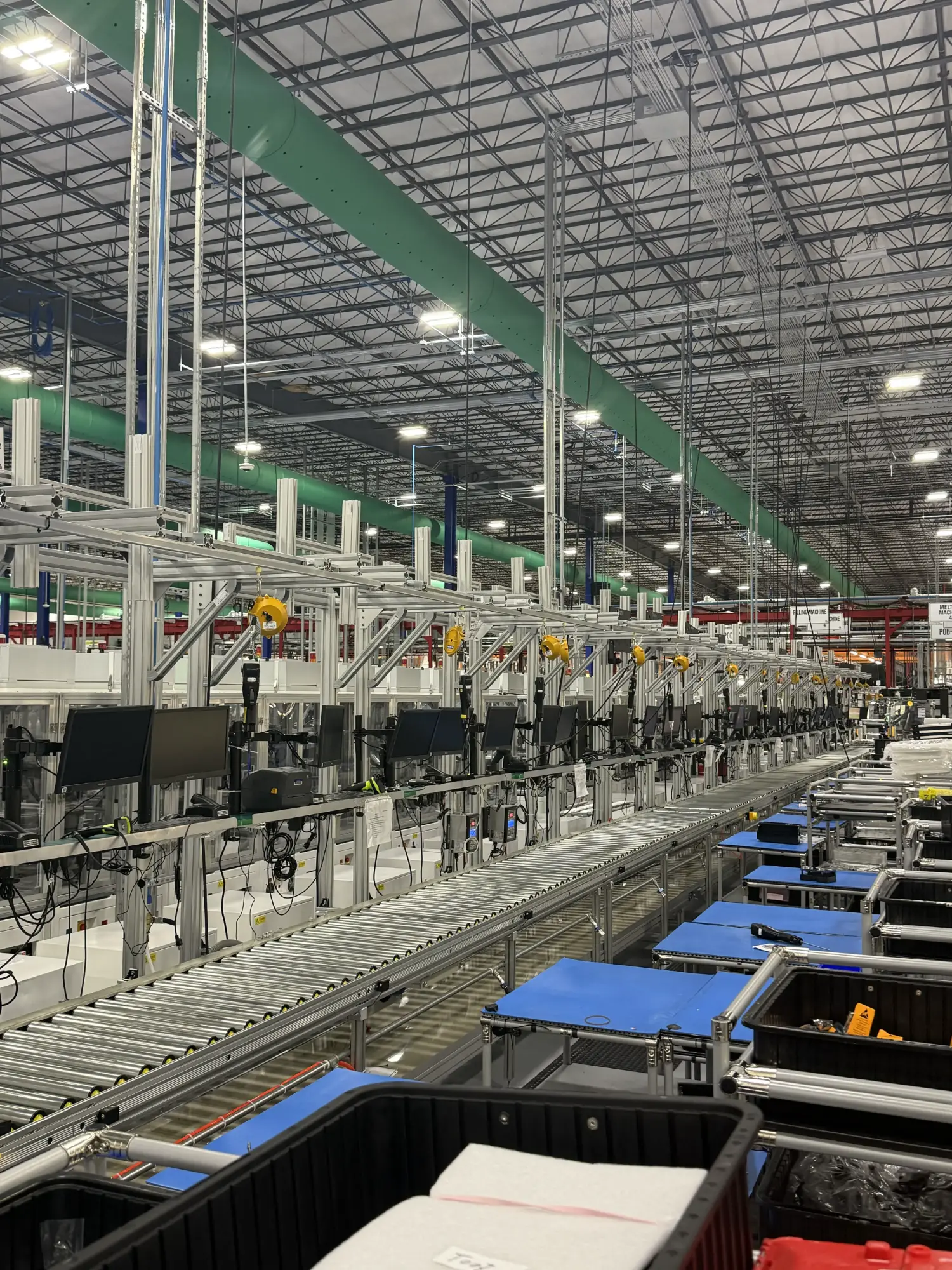 Roller conveyor line running the length of a production hall
